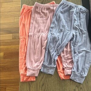 Set of Three Kyte BABY Pants in Coral, Mauve, and Purple
